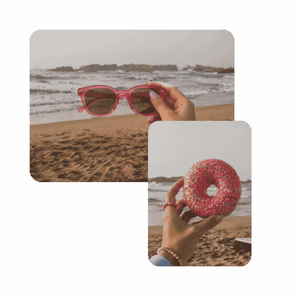 Lunettes de soleil femme modèle Rose Beignet monture rose transparente et verres fumés brun rosé, tenues à la main sur une plage avec mer et rochers en arrière-plan, accessoire plage tendance collection été Chouchou Beignet Marseille.